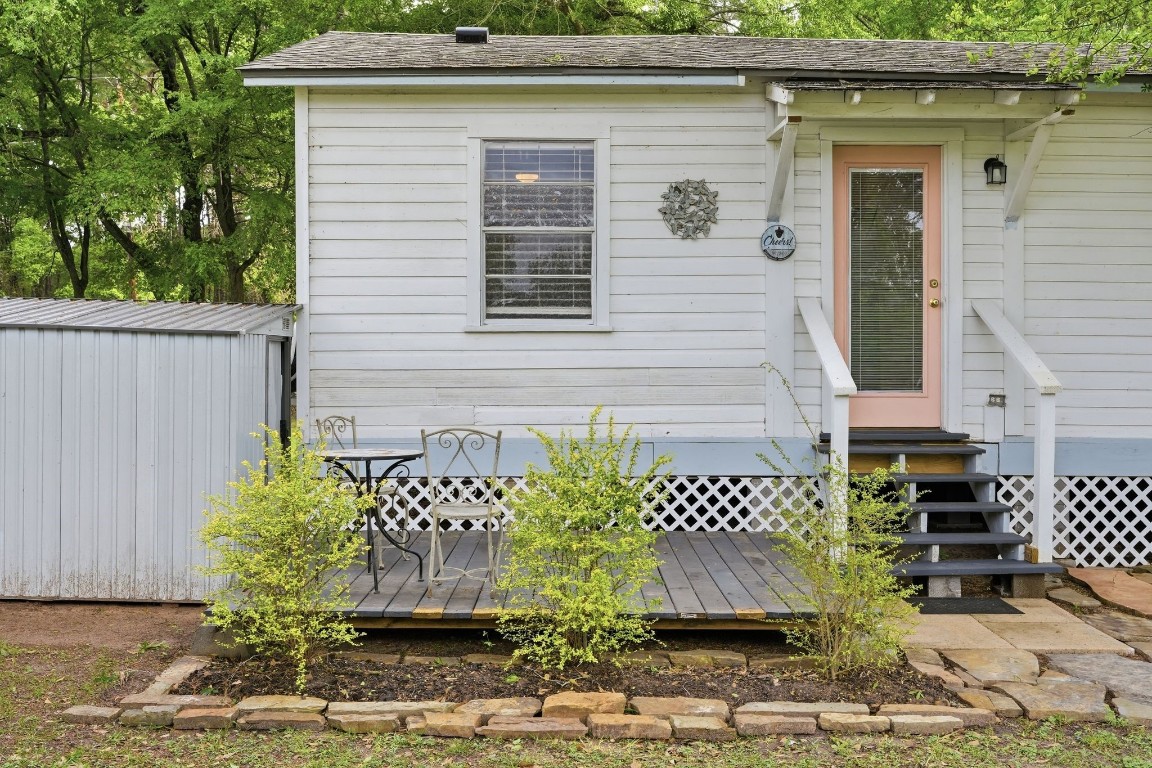 11757 Calvary Road Willis, TX 77318 - Photo 21 of 33 Cozy back porch with a small seating area, perfect for enjoying a quiet morning or evening outside.