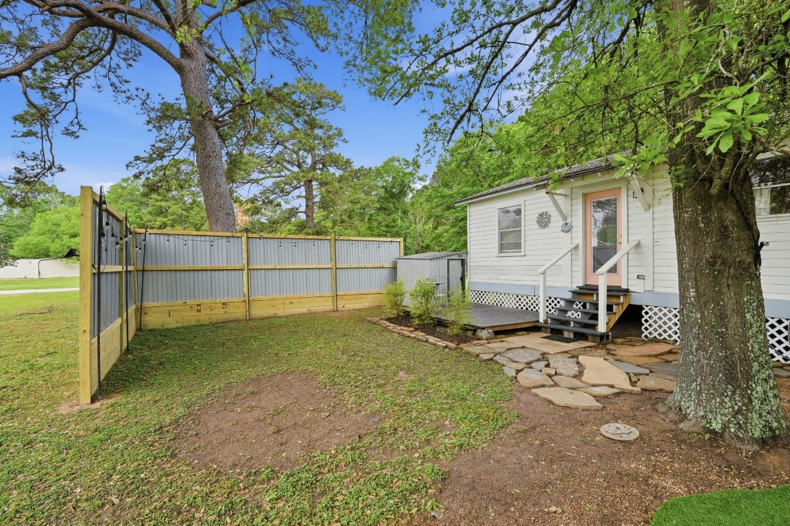 11757 Calvary Road Willis, TX 77318 - Photo 27 of 33 Private outdoor area with a fenced section perfect for pets, gardening, or a quiet hangout space.