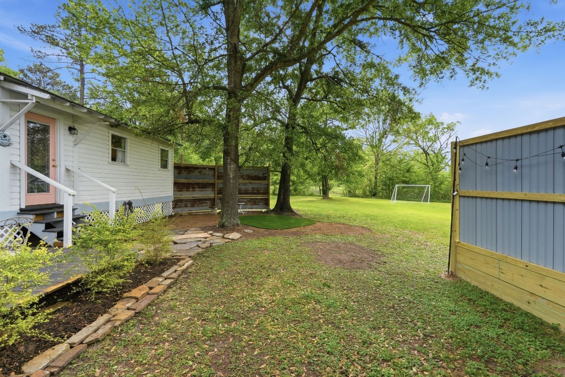 11757 Calvary Road Willis, TX 77318 - Photo 28 of 33 Spacious backyard with plenty of room to play, relax, or set up your own outdoor retreat.