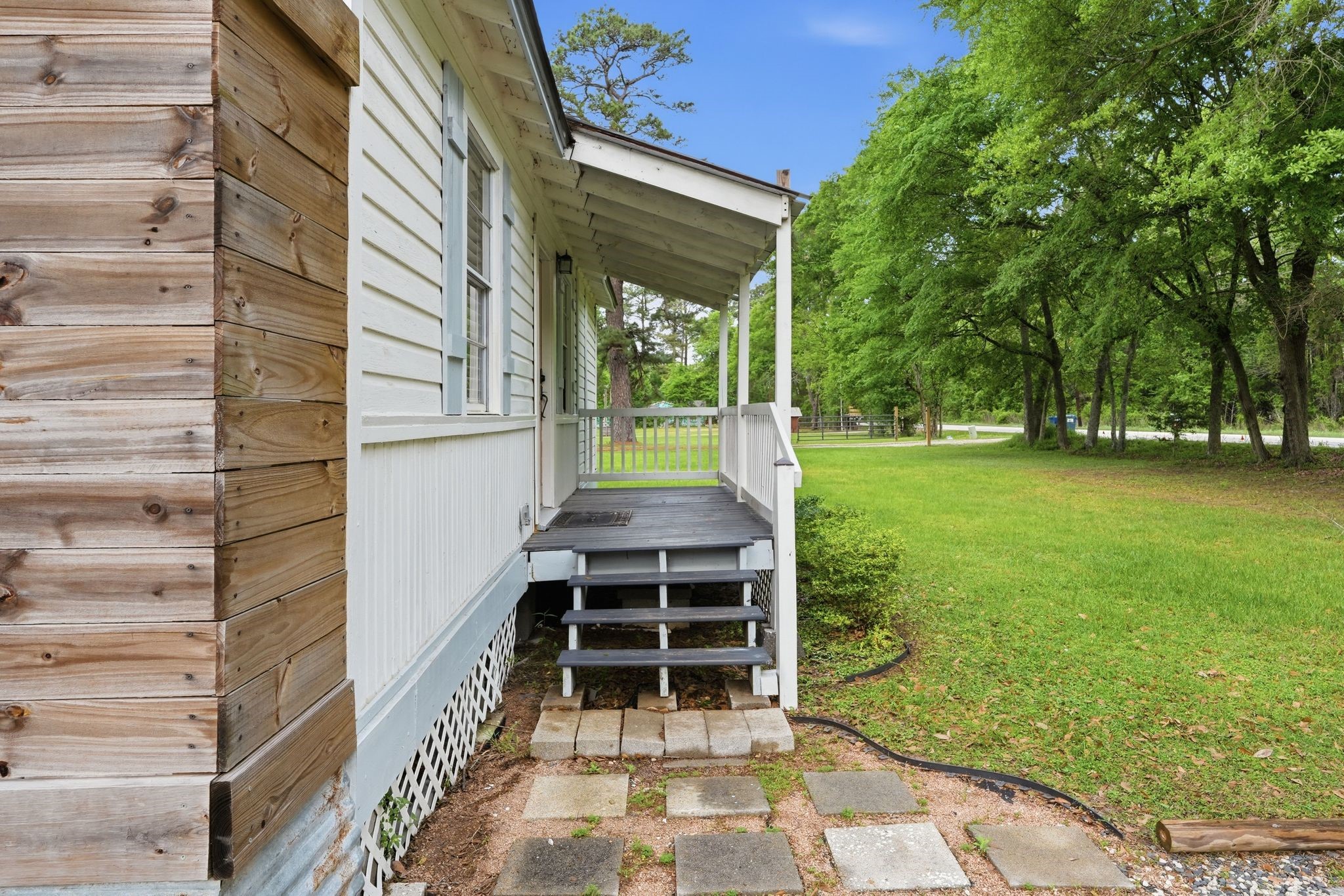 11757 Calvary Road Willis, TX 77318 - Photo 4 of 33 Small covered porch with easy access, perfect for a quiet morning or evening break.