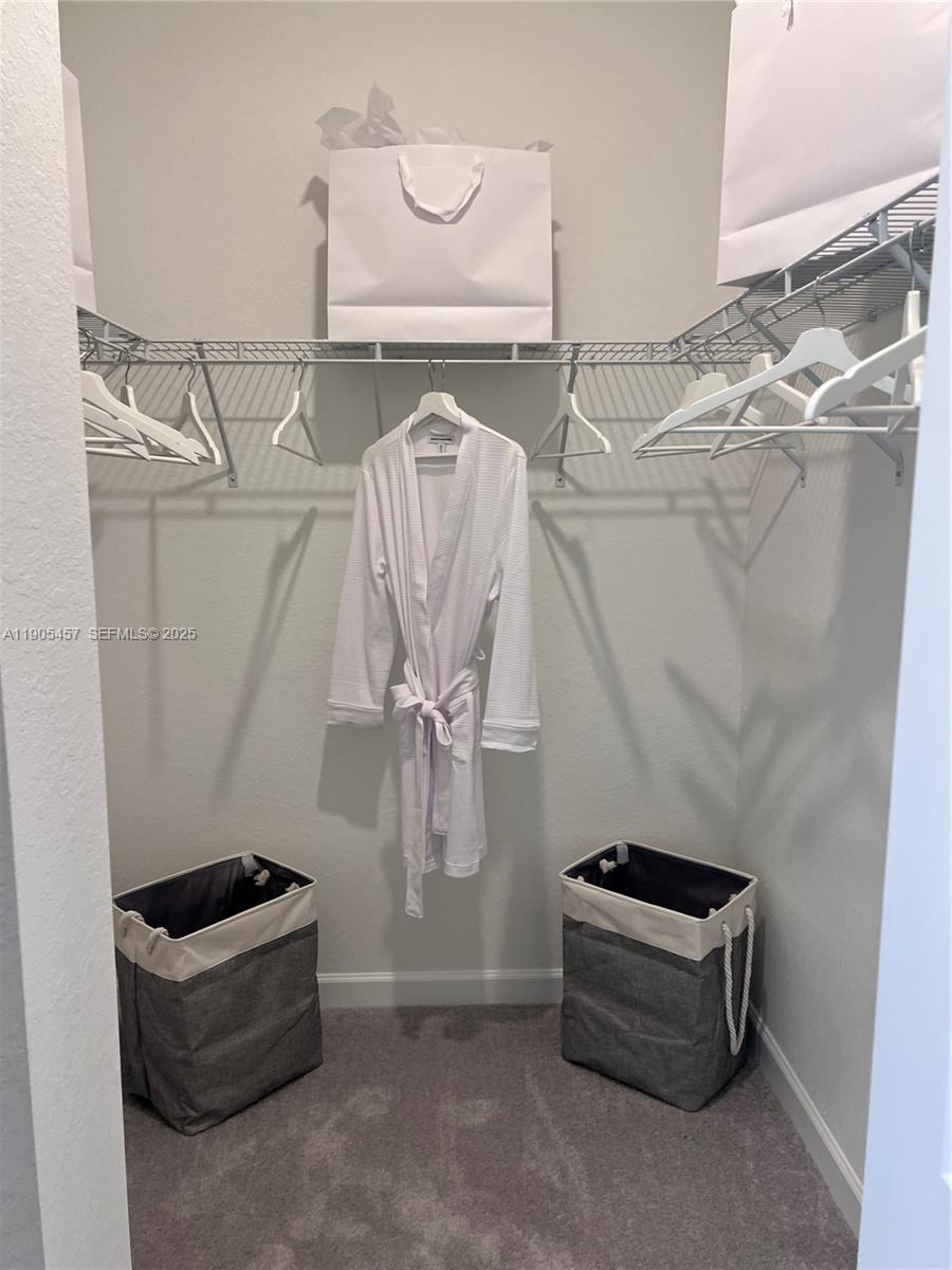 640 Southeast 14th Street Homestead, FL 33034 - Photo 12 of 29 a room with a wooden floor and white walls