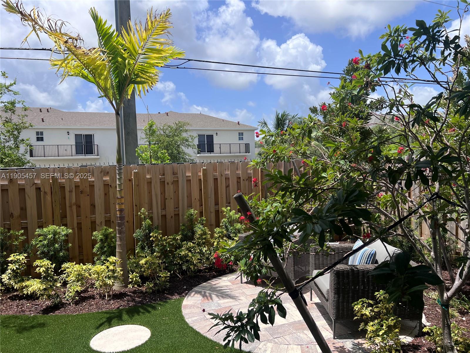 640 Southeast 14th Street Homestead, FL 33034 - Photo 18 of 29 a view of a garden with a fountain