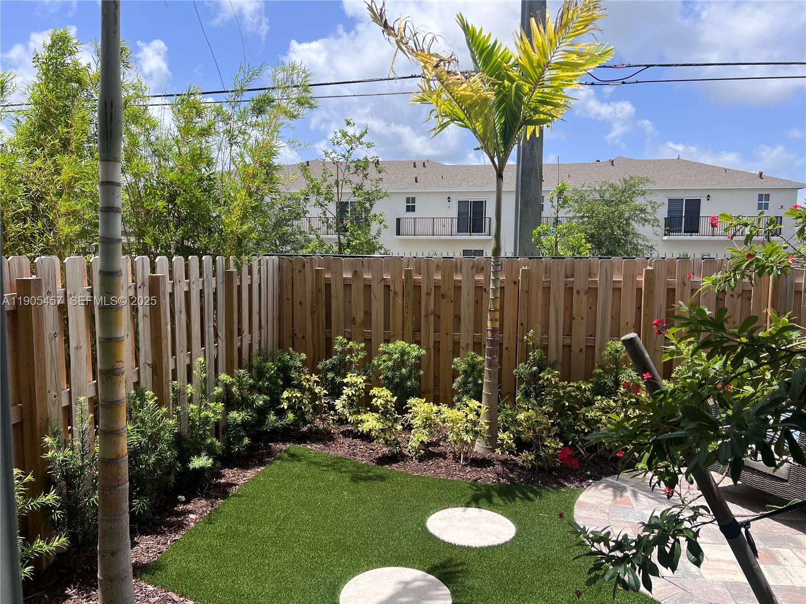 640 Southeast 14th Street Homestead, FL 33034 - Photo 20 of 29 a view of a house with a yard and garden