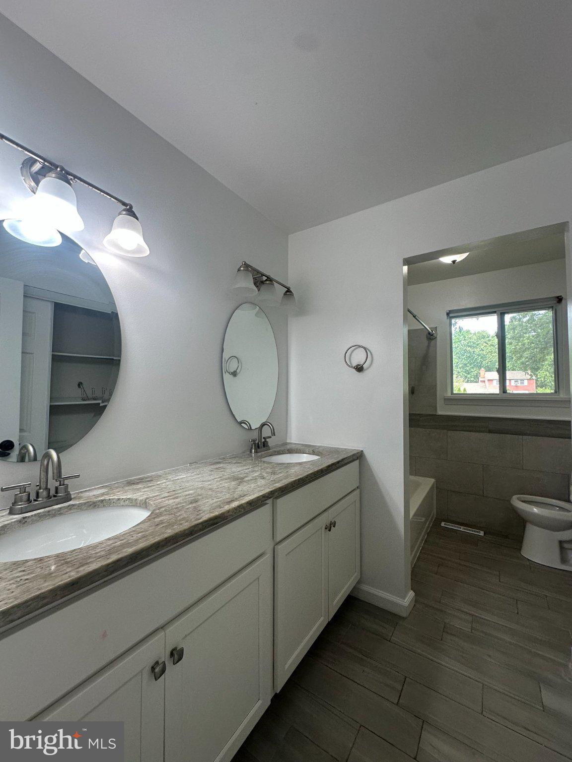 6 Travertine Way Newark, DE 19702 - Photo 13 of 22 a bathroom with a granite countertop sink mirror and toilet