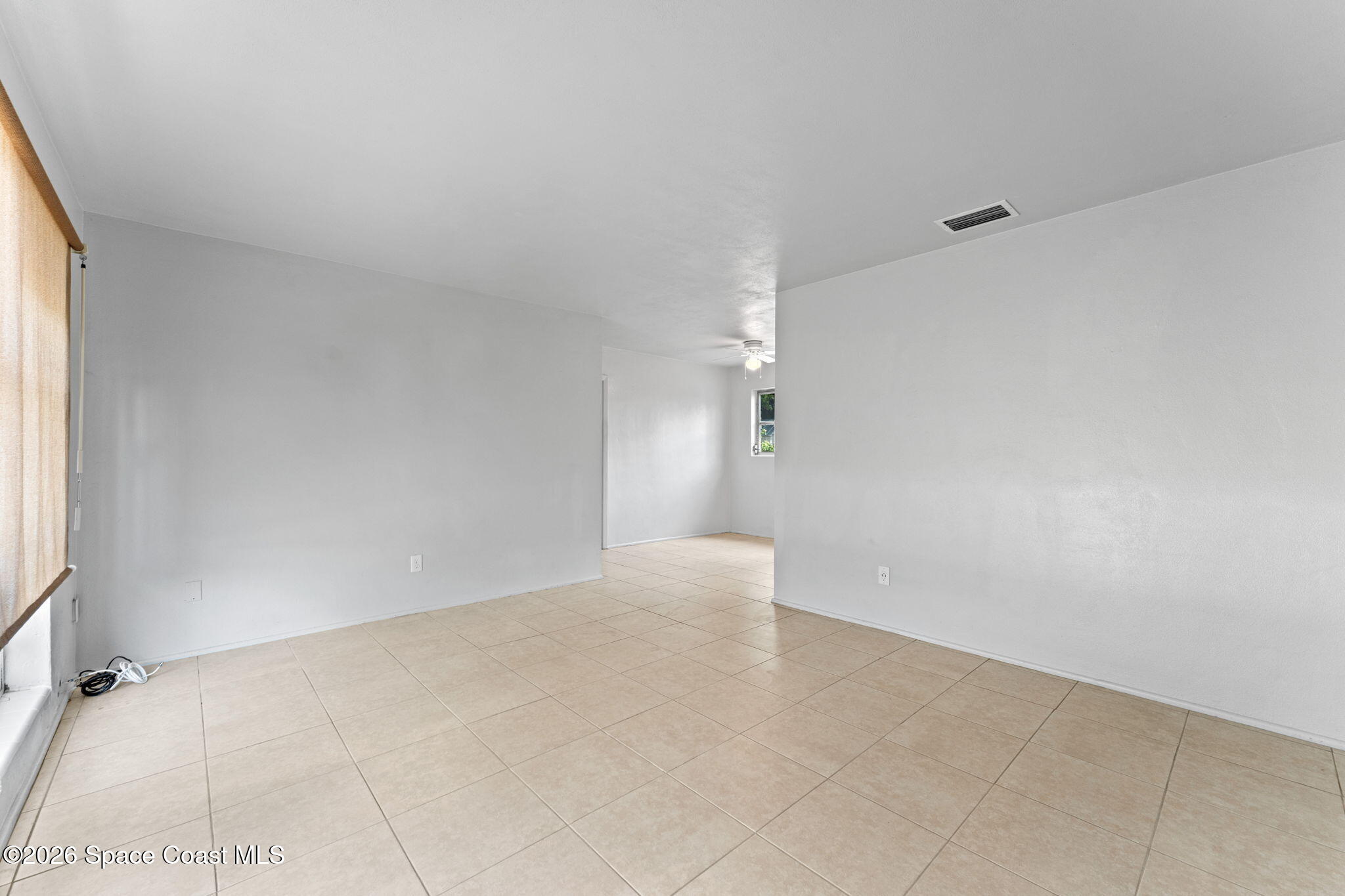 1042 Azalea Lane Cocoa, FL 32922 - Photo 4 of 26 an empty room with windows