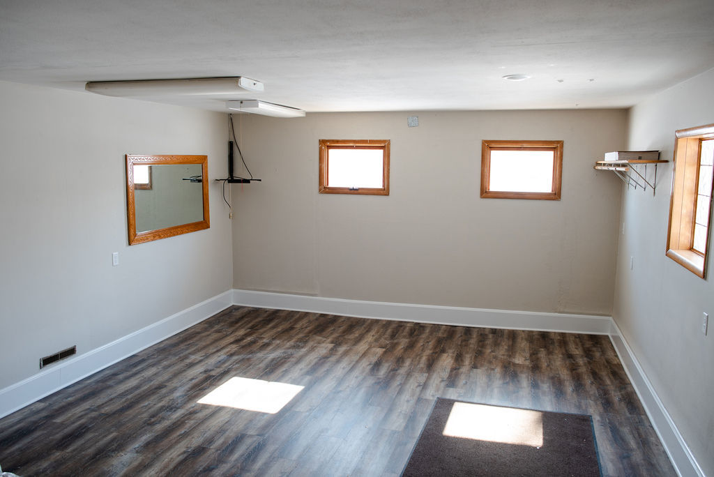 425 West Donald Street Kankakee, IL 60901 - Photo 14 of 14 wooden floor in an empty room with a window