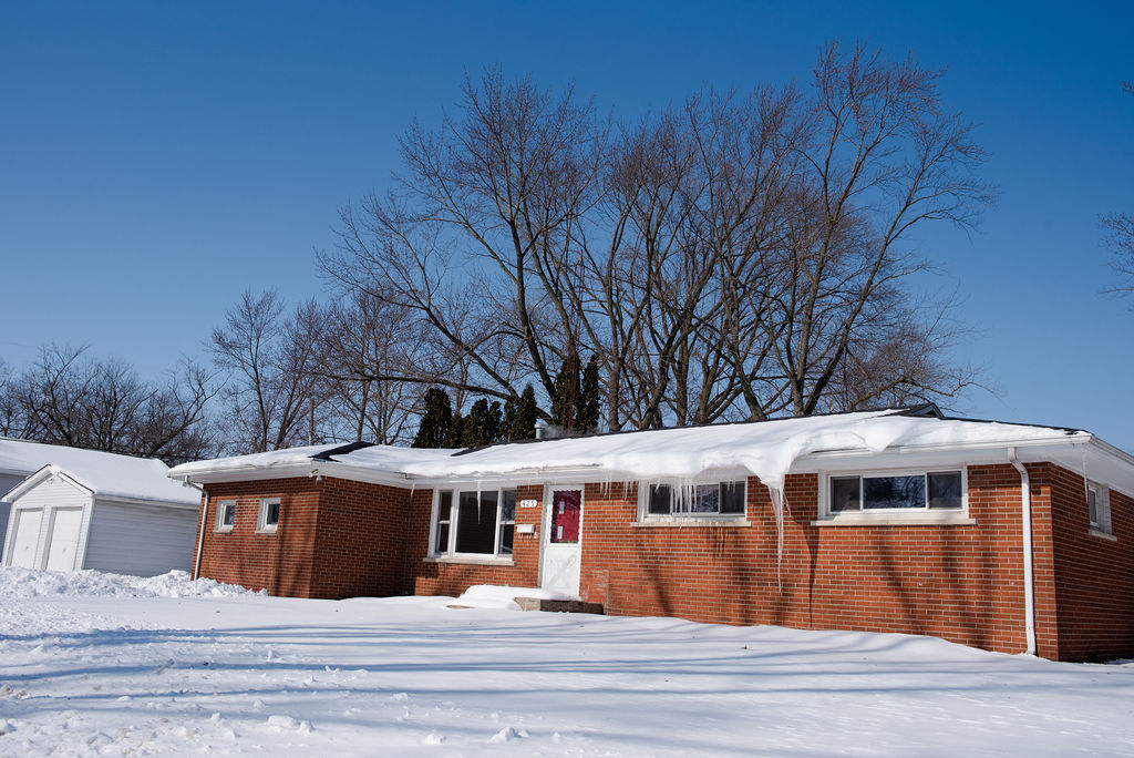 425 West Donald Street Kankakee, IL 60901 - Photo 2 of 14 a front view of a house with a garden