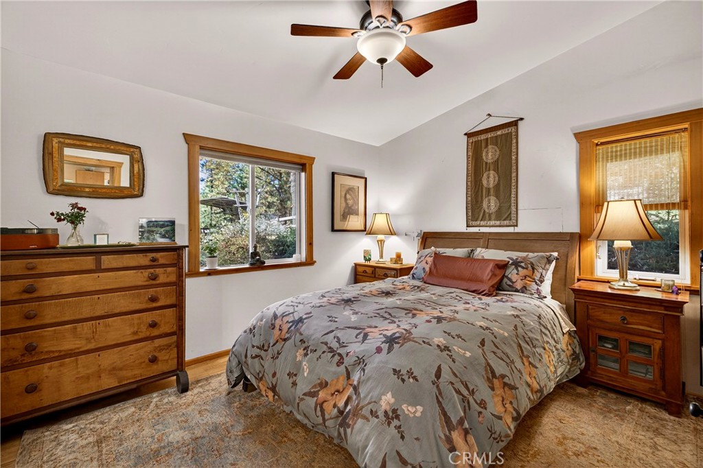 15001 Culiacan Court Forest Ranch, CA 95942 - Photo 17 of 66 a bedroom with a bed and wooden floor
