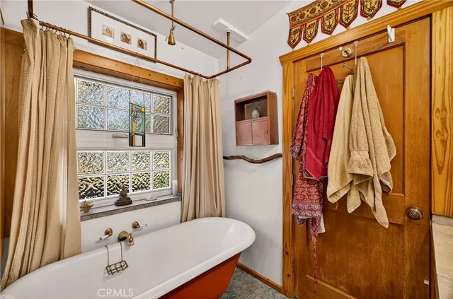 a spacious bathroom with a sink a mirror and shower