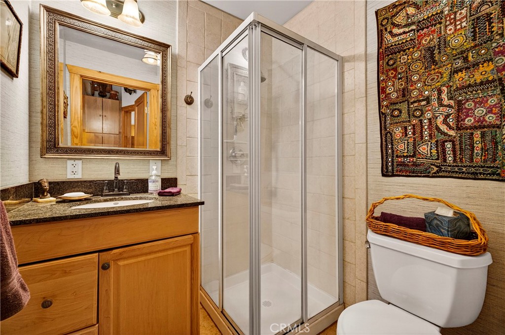 15001 Culiacan Court Forest Ranch, CA 95942 - Photo 21 of 66 a bathroom with a toilet a sink and a mirror
