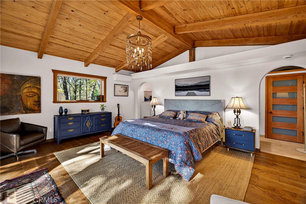 15001 Culiacan Court Forest Ranch, CA 95942 - Photo 22 of 66 a bedroom with a large bed and a tv