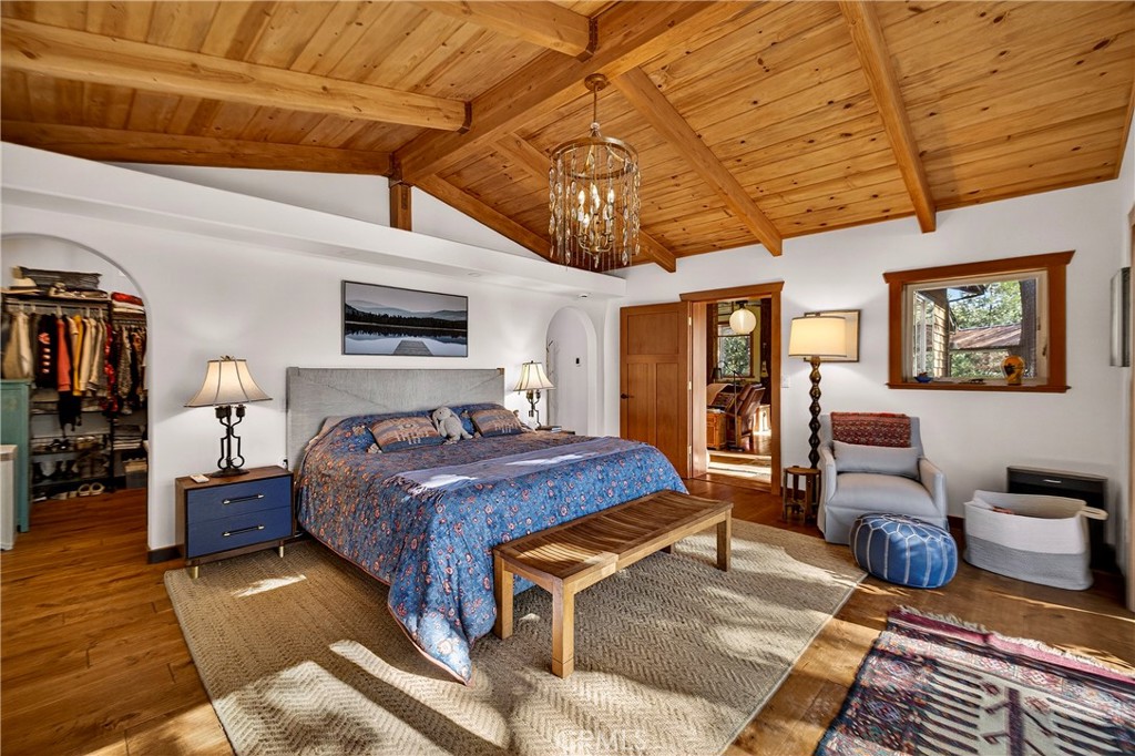 15001 Culiacan Court Forest Ranch, CA 95942 - Photo 23 of 66 a bedroom with a bed and wooden floors