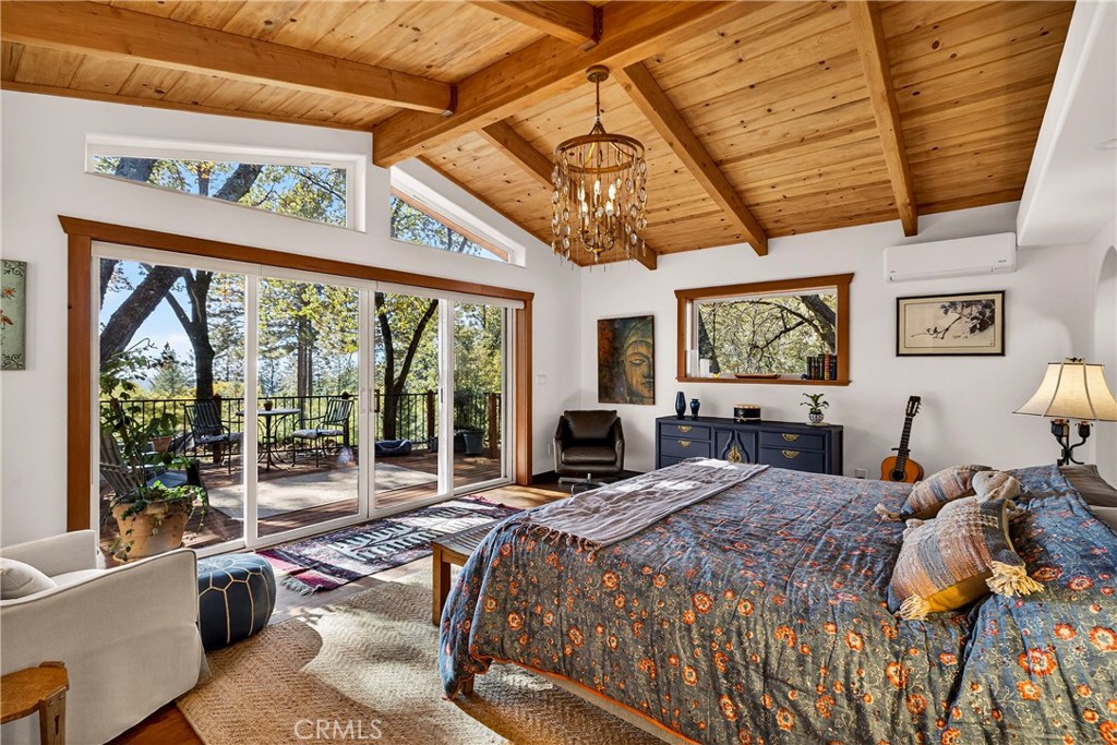 15001 Culiacan Court Forest Ranch, CA 95942 - Photo 24 of 66 a bedroom with a bed and wooden floor