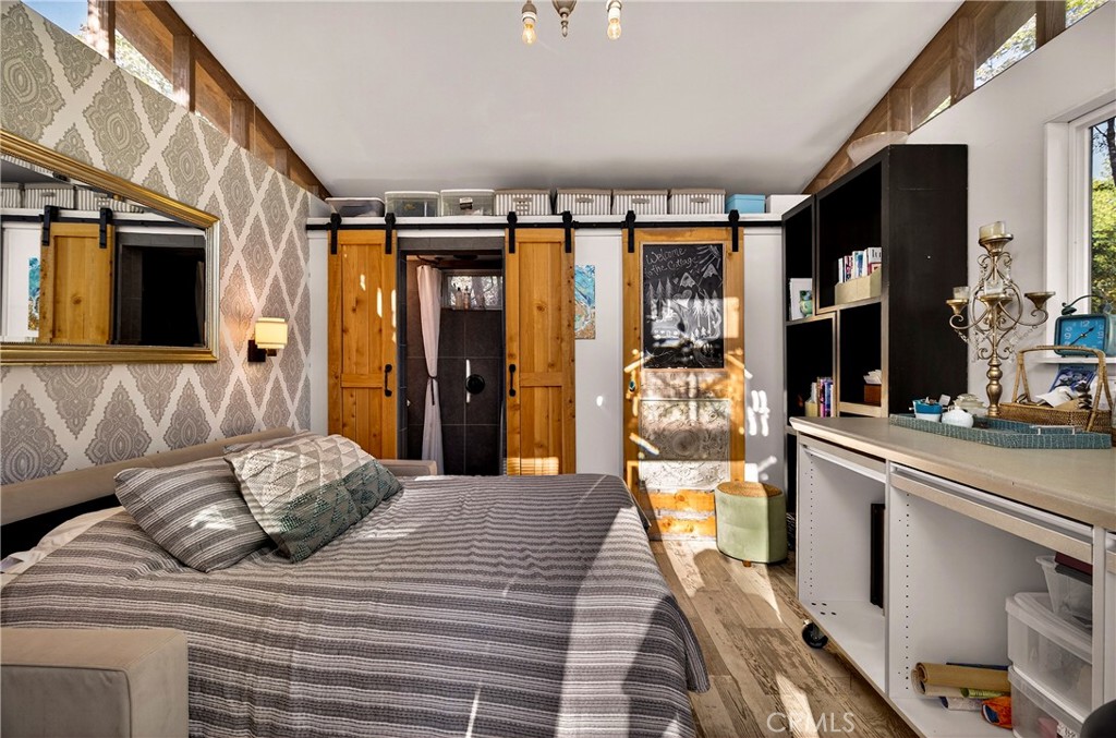 15001 Culiacan Court Forest Ranch, CA 95942 - Photo 38 of 66 a bedroom with a large bed and a large window