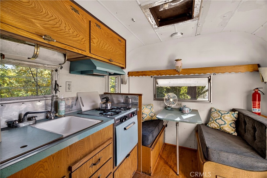 15001 Culiacan Court Forest Ranch, CA 95942 - Photo 46 of 66 a kitchen with stainless steel appliances a sink a stove and a microwave