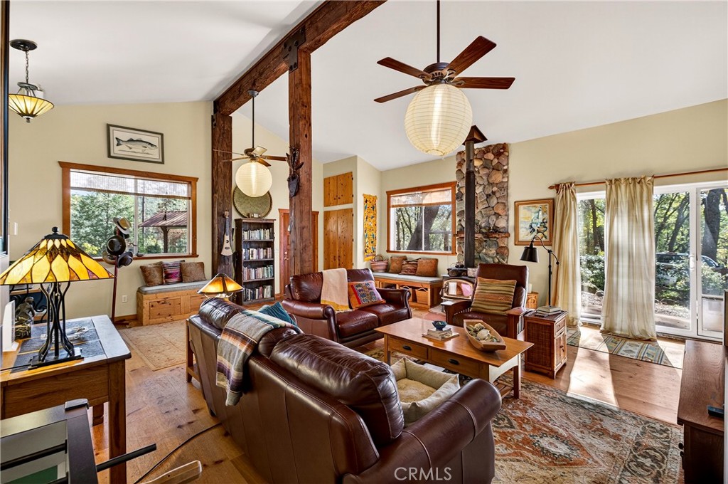 15001 Culiacan Court Forest Ranch, CA 95942 - Photo 9 of 66 a living room with furniture ceiling fan and a large window