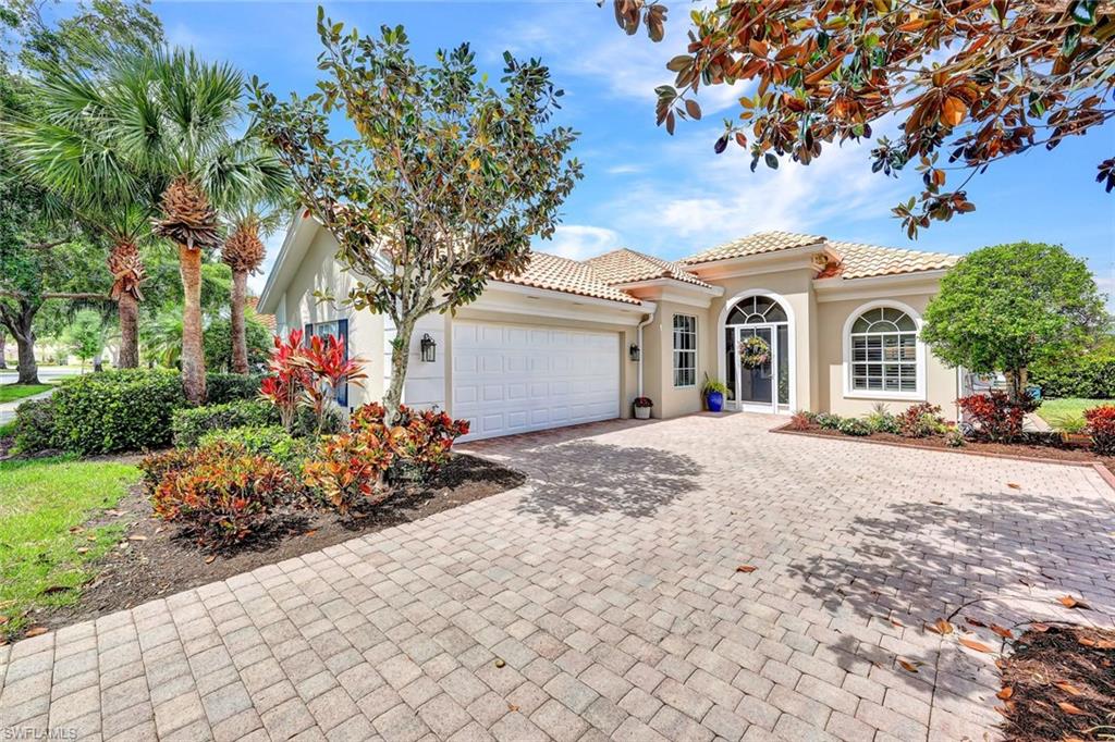 5441 Freeport Lane Naples, FL 34119 - Photo 1 of 2 front view of a house with a tree