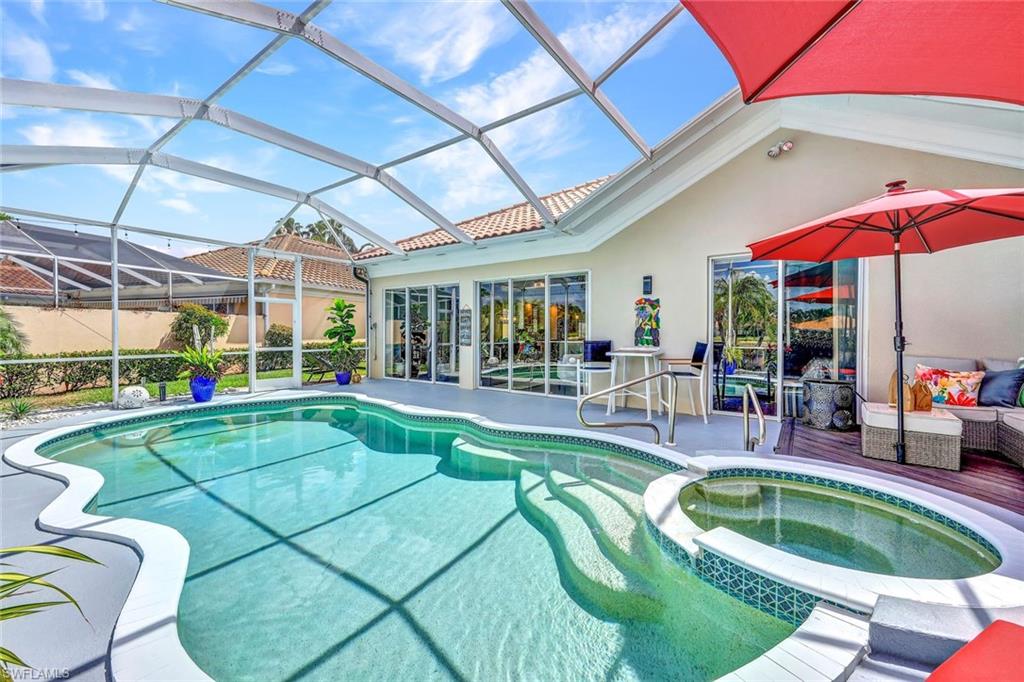 5441 Freeport Lane Naples, FL 34119 - Photo 2 of 2 a view of a backyard with swimming pool