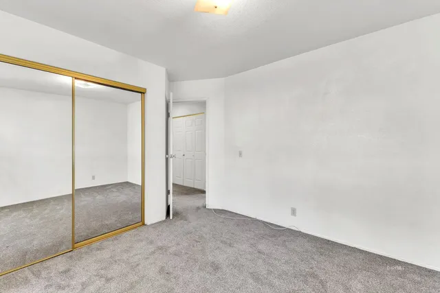 a backyard of a house with large trees