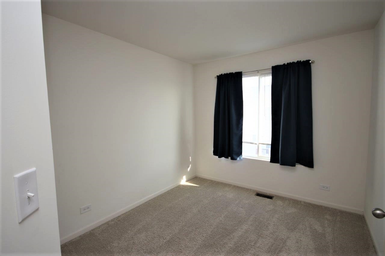 1785 Ruby Drive Pingree Grove, IL 60140 - Photo 11 of 24 an empty room with windows