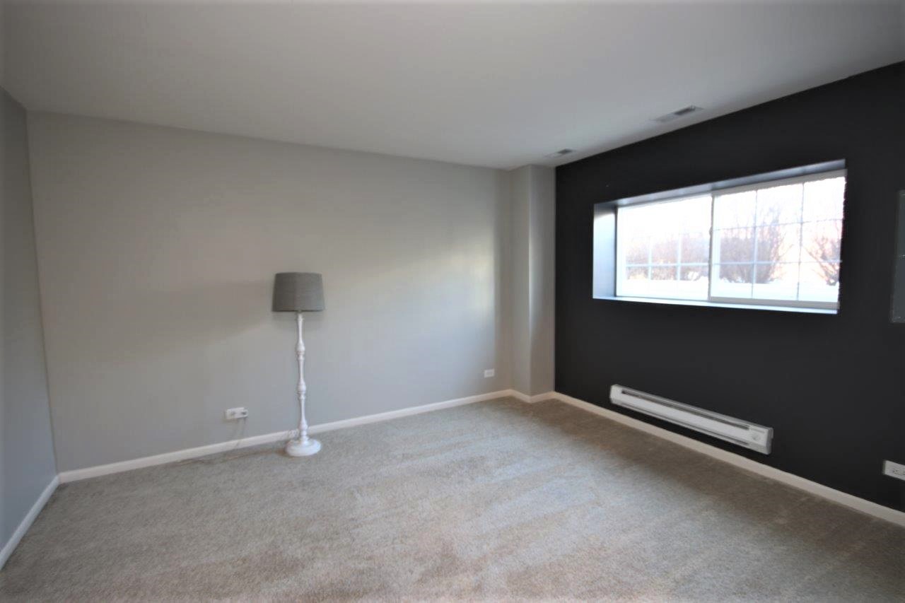 1785 Ruby Drive Pingree Grove, IL 60140 - Photo 16 of 24 a view of an empty room with a window