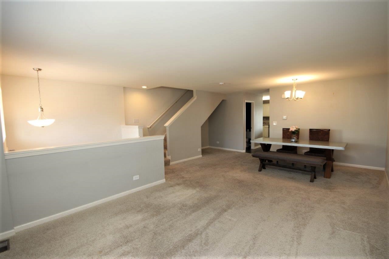 1785 Ruby Drive Pingree Grove, IL 60140 - Photo 3 of 24 a view of a room with a table and chairs