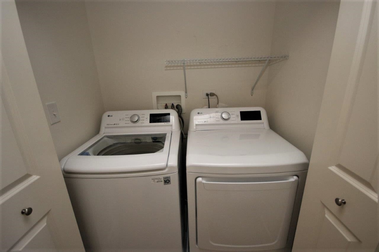 1785 Ruby Drive Pingree Grove, IL 60140 - Photo 10 of 24 a utility room with dryer and washer