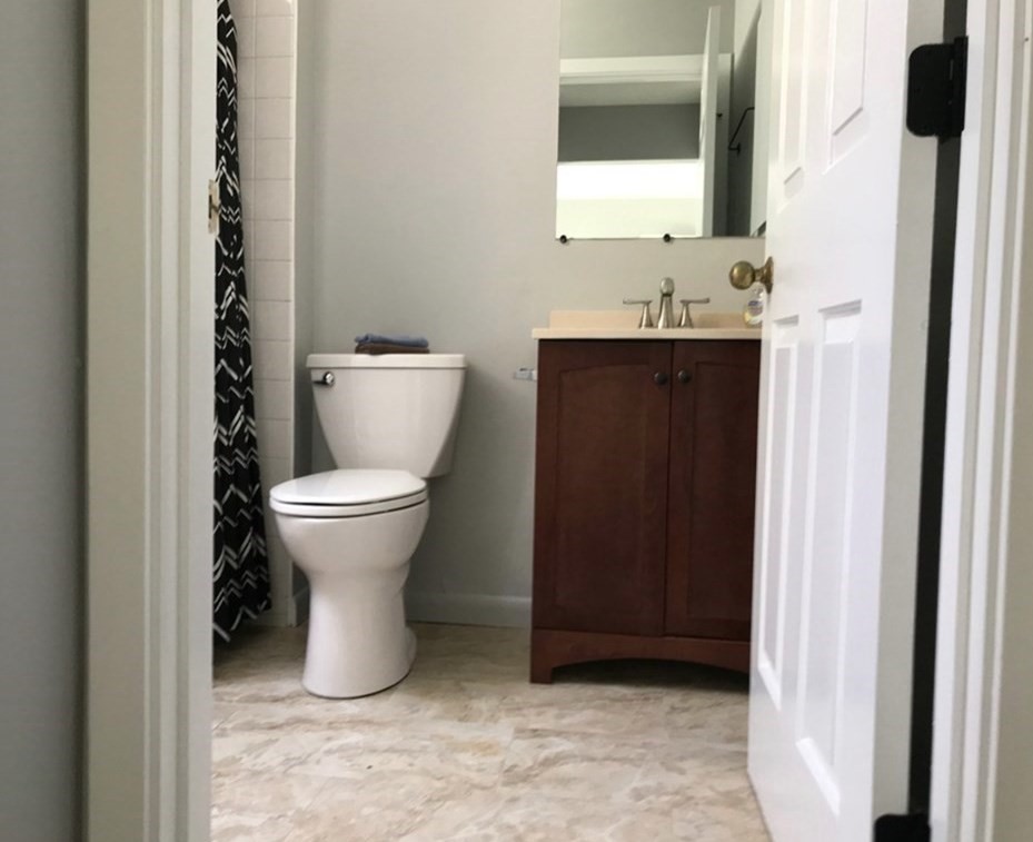 34 Salem Place, Unit 34 Amherst, MA 01002 - Photo 6 of 8 a bathroom with a toilet sink and mirror