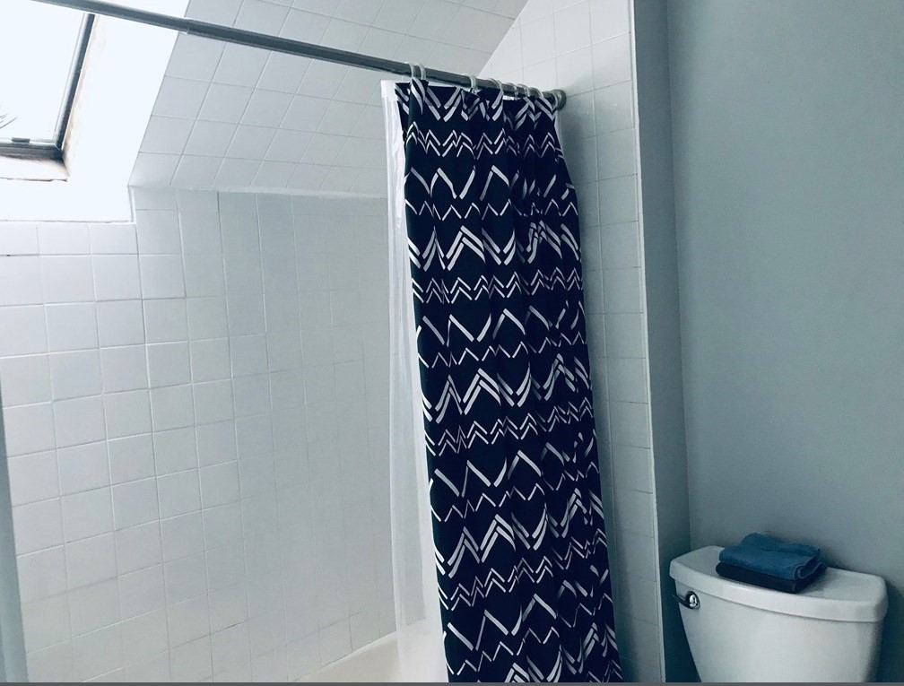 34 Salem Place, Unit 34 Amherst, MA 01002 - Photo 8 of 8 a bathroom with a toilet and a shower curtain