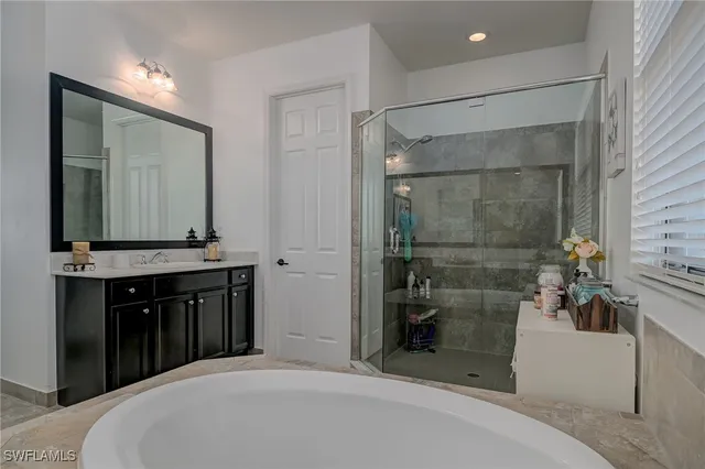 a bathroom with a bathtub and a sink