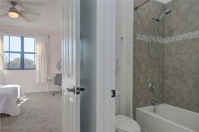 a bathroom with a tub and shower