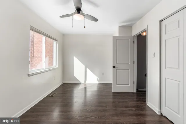 a view of room with wooden floor
