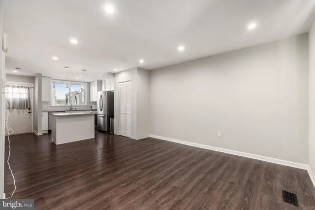 a view of kitchen dining table chairs and cabinets