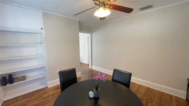 a view of a living room and wooden floor