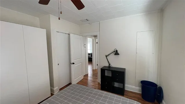 a view of a hallway with entryway wooden floor and front door