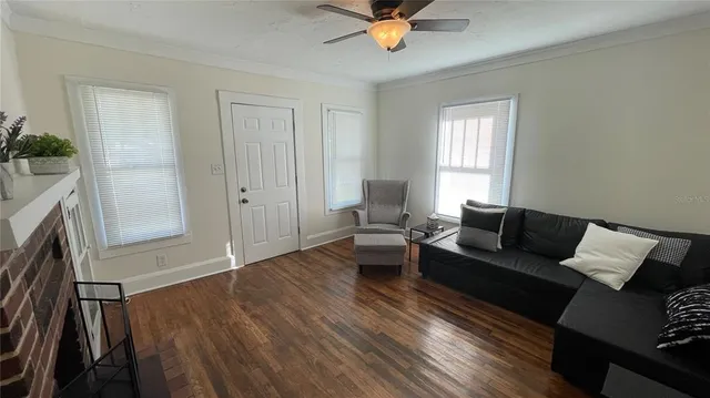 a living room with furniture and a fireplace