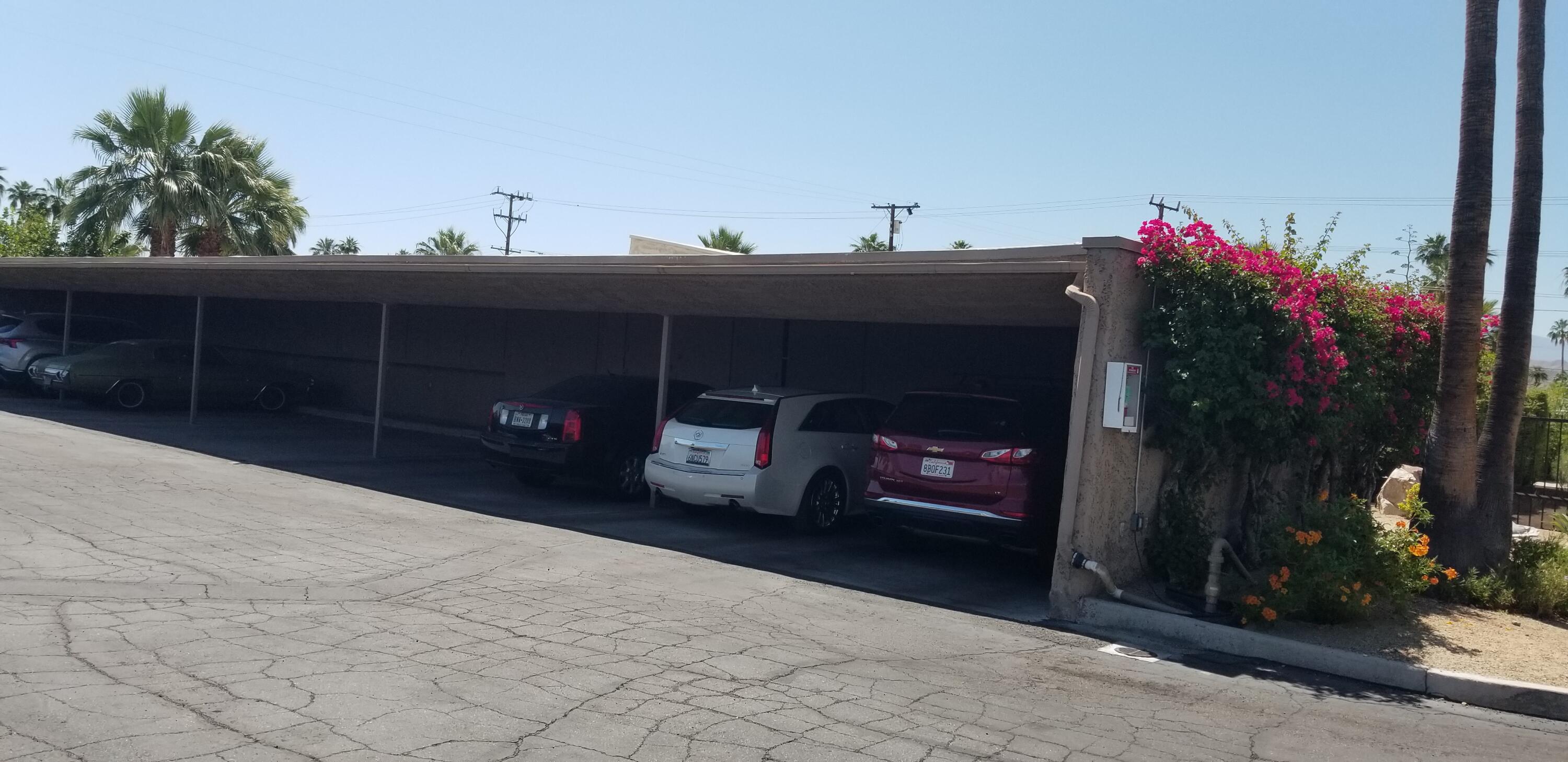 1111 Ramon Road, Unit 106 Palm Springs, CA 92264 - Photo 41 of 42 Covered Carport with storage locker
