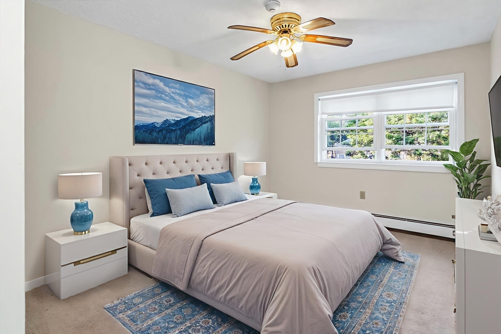 35 Fernview Avenue, Unit 5 North Andover, MA 01845 - Photo 11 of 32 a bedroom with a bed and a chandelier