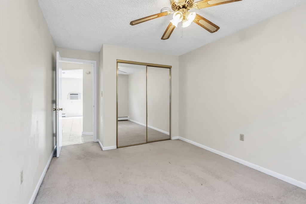 35 Fernview Avenue, Unit 5 North Andover, MA 01845 - Photo 14 of 32 a view of an empty room and chandelier fan