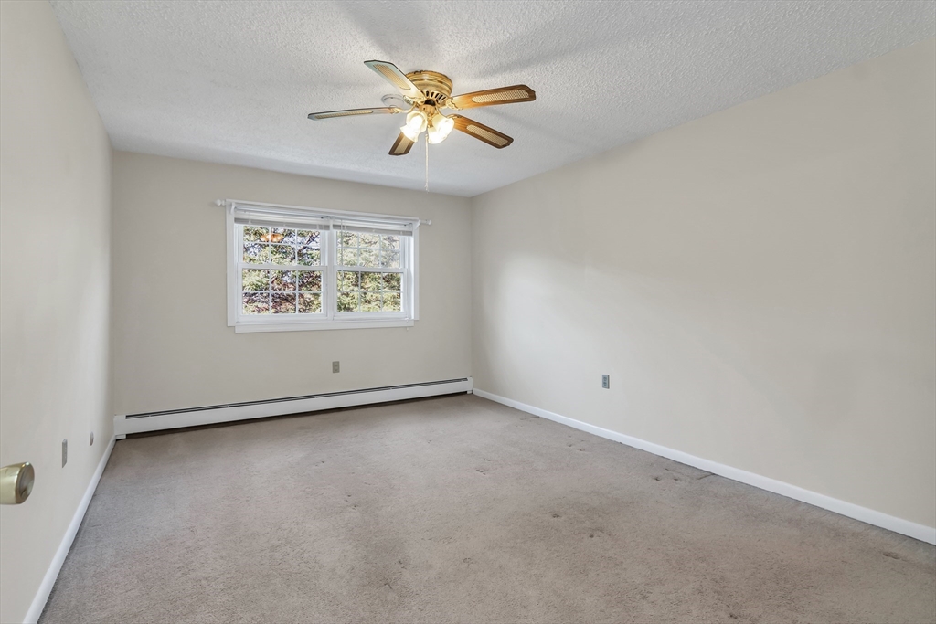 35 Fernview Avenue, Unit 5 North Andover, MA 01845 - Photo 17 of 32 an empty room with windows and fan