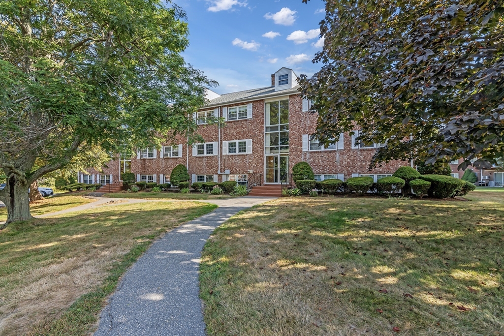 35 Fernview Avenue, Unit 5 North Andover, MA 01845 - Photo 24 of 32 a view of a house with a big yard and large trees