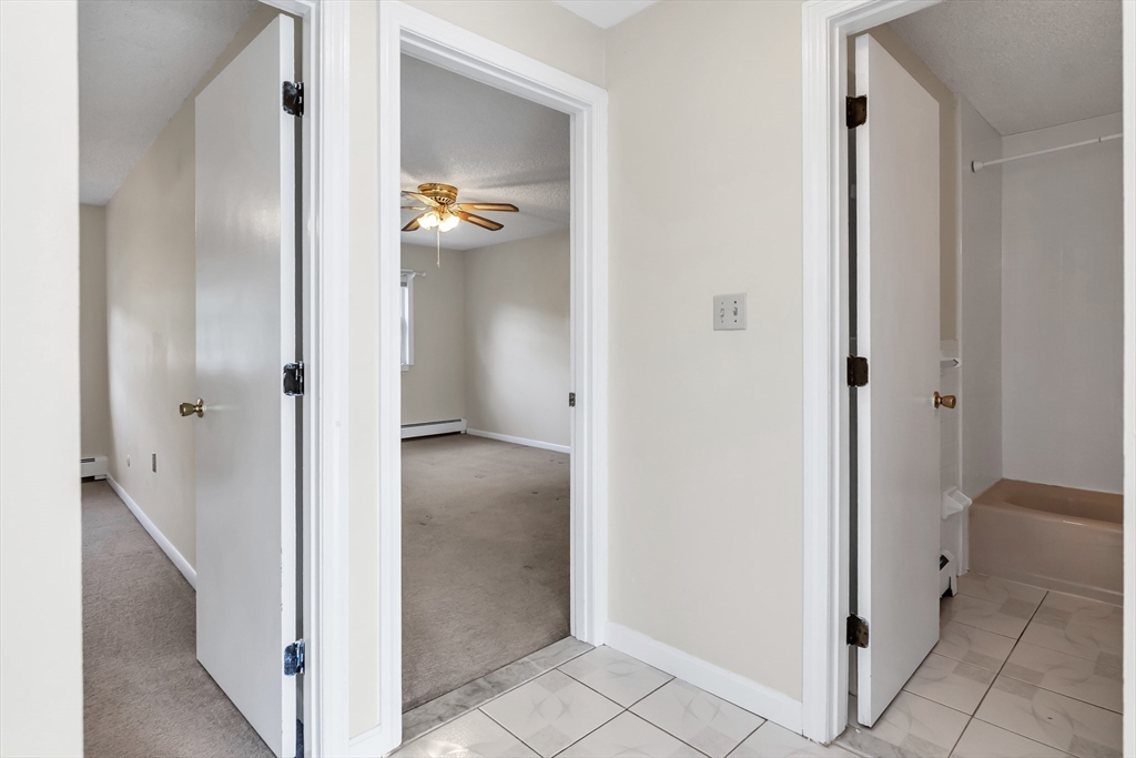 35 Fernview Avenue, Unit 5 North Andover, MA 01845 - Photo 10 of 32 hallway with wooden floor