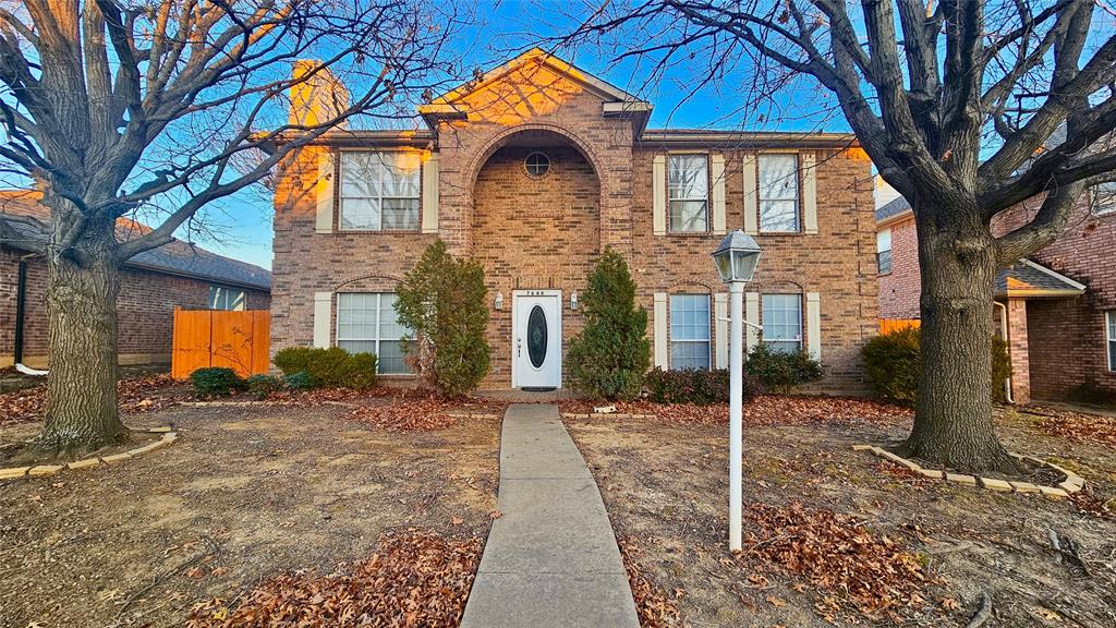 7640 Tournament Road Frisco, TX 75035 - Photo 1 of 25 a front view of a house with a yard