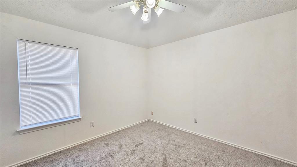 7640 Tournament Road Frisco, TX 75035 - Photo 12 of 25 an empty room with a window