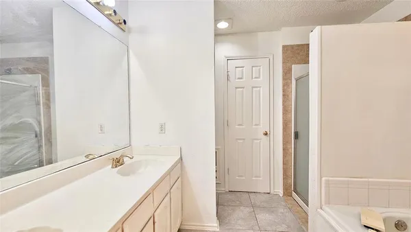 a view of empty room with window and a ceiling fan