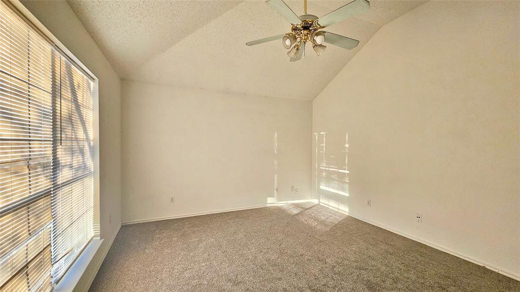 7640 Tournament Road Frisco, TX 75035 - Photo 19 of 25 a view of empty room with window and a ceiling fan