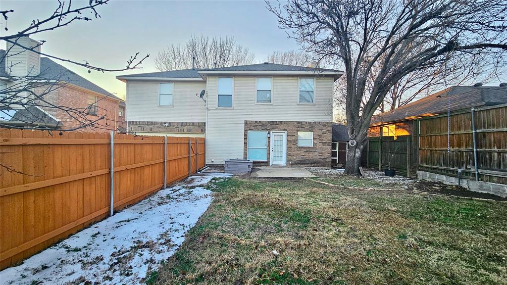 7640 Tournament Road Frisco, TX 75035 - Photo 22 of 25 a view of a backyard with large trees