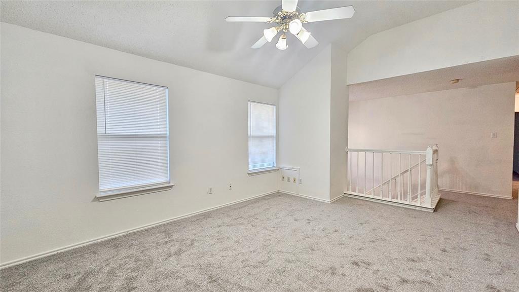 7640 Tournament Road Frisco, TX 75035 - Photo 8 of 25 an empty room with windows and fan
