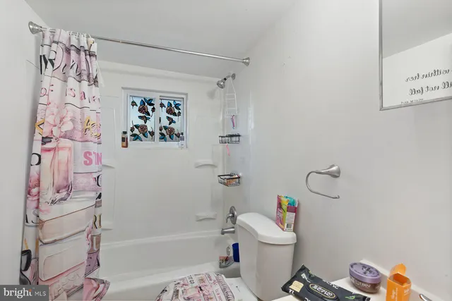 a bathroom with a bathtub a sink and a shower