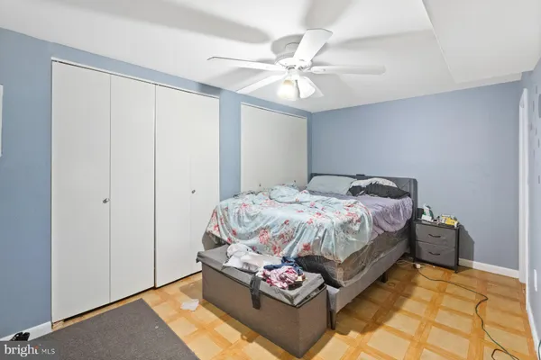 a bedroom with bed and window